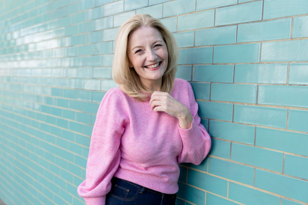 Wendy Bollard wearing pink jumper in Notting Hill personal brand photography London
